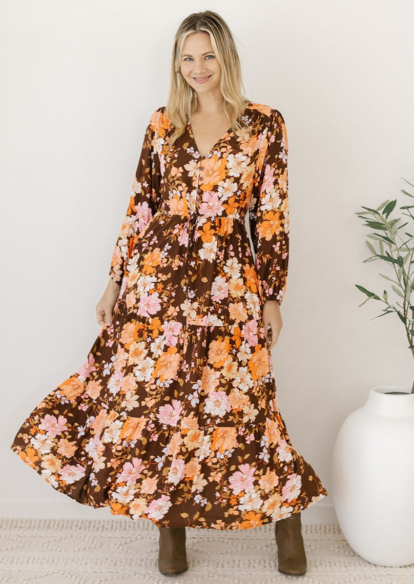 brown and orange floral long-sleeved midi dress