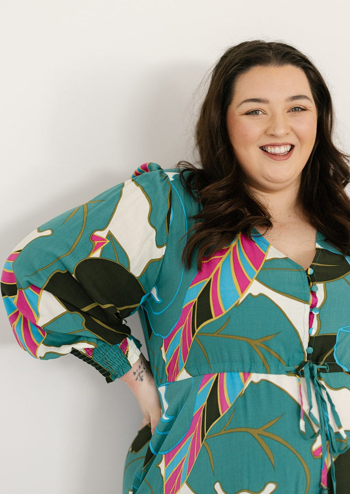 Long-sleeved plus-size green maxi dress with pockets