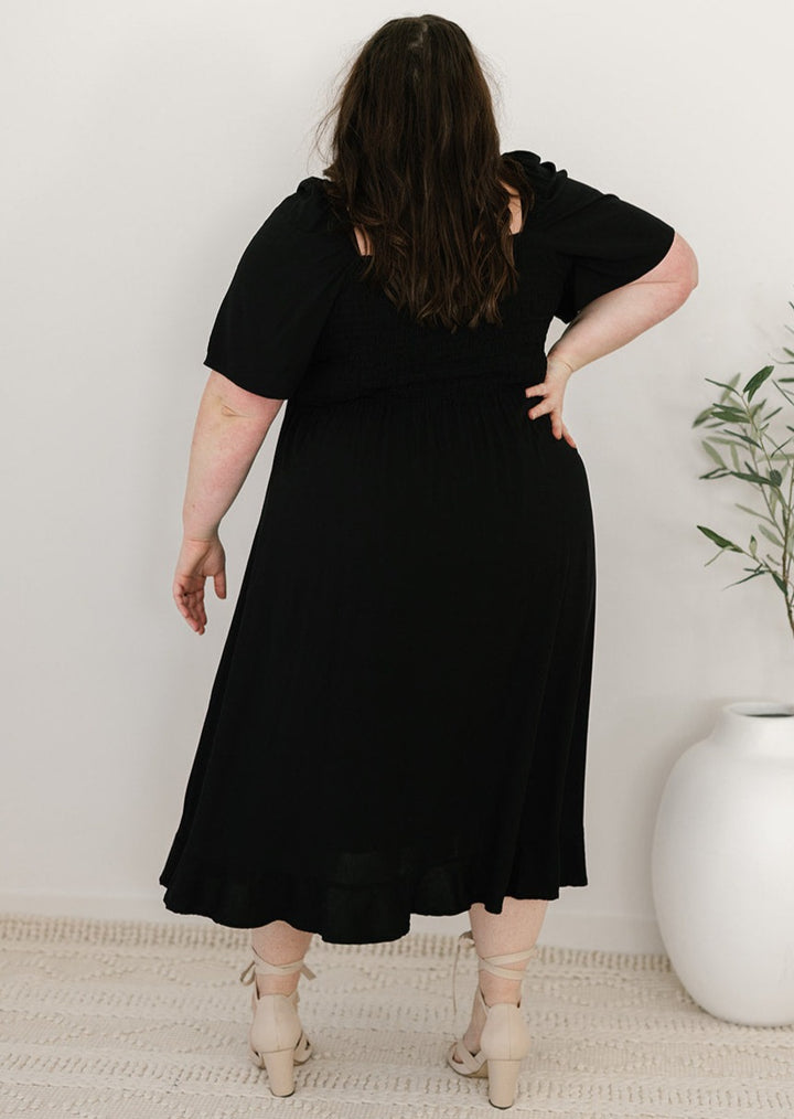Bump-friendly black midi dress with lined skirt