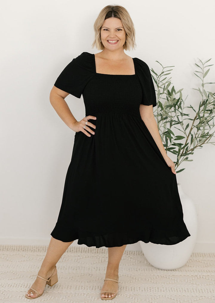 Black plus-size midi dress with shirred bodice
