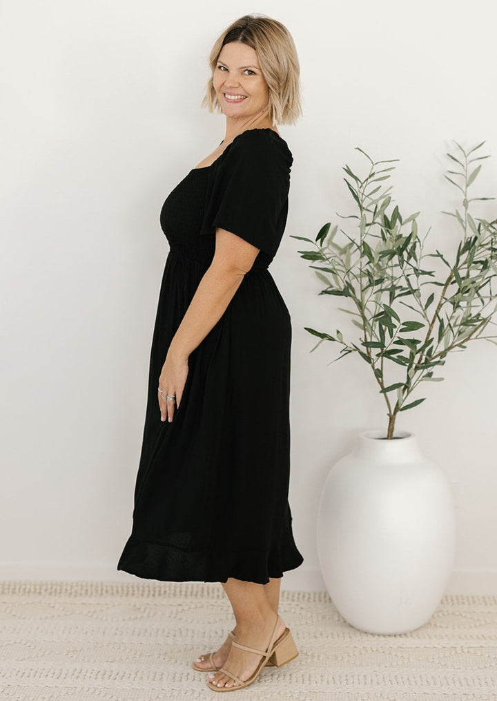 Bump-friendly black midi dress