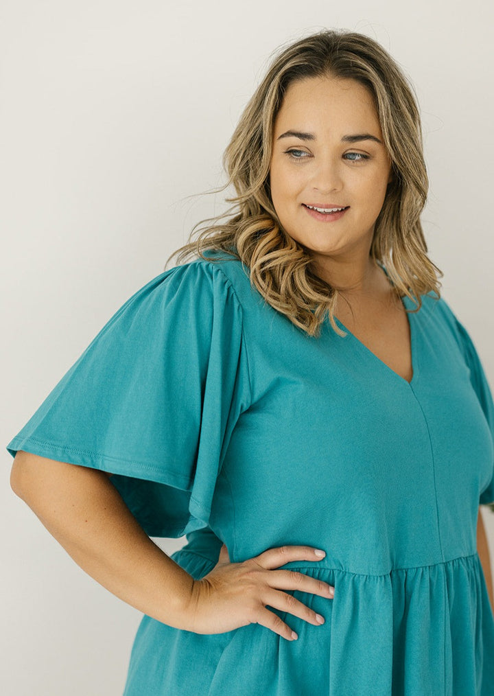 women's peplum-style top in teal
