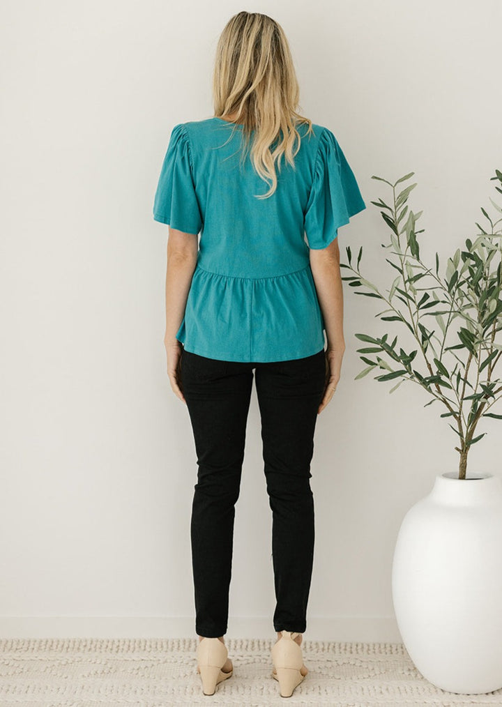 ladies green peplum t-shirt with flutter sleeves