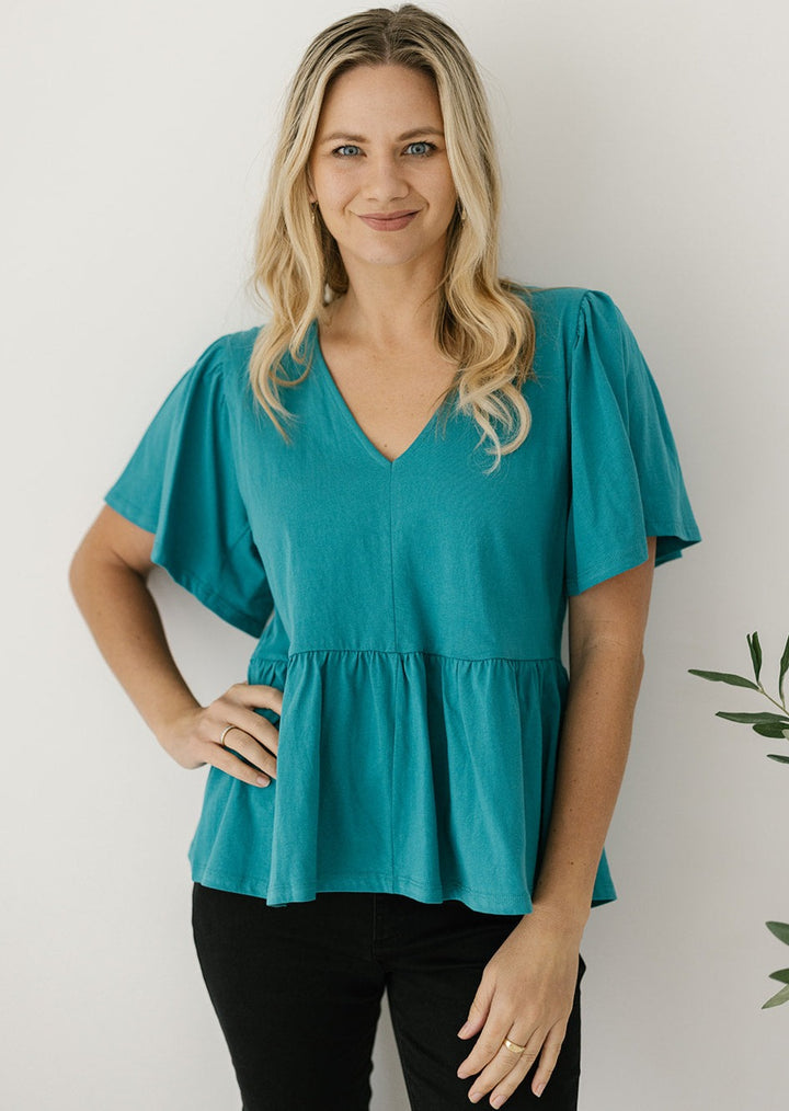 teal flutter-sleeved peplum top for plus-sized women
