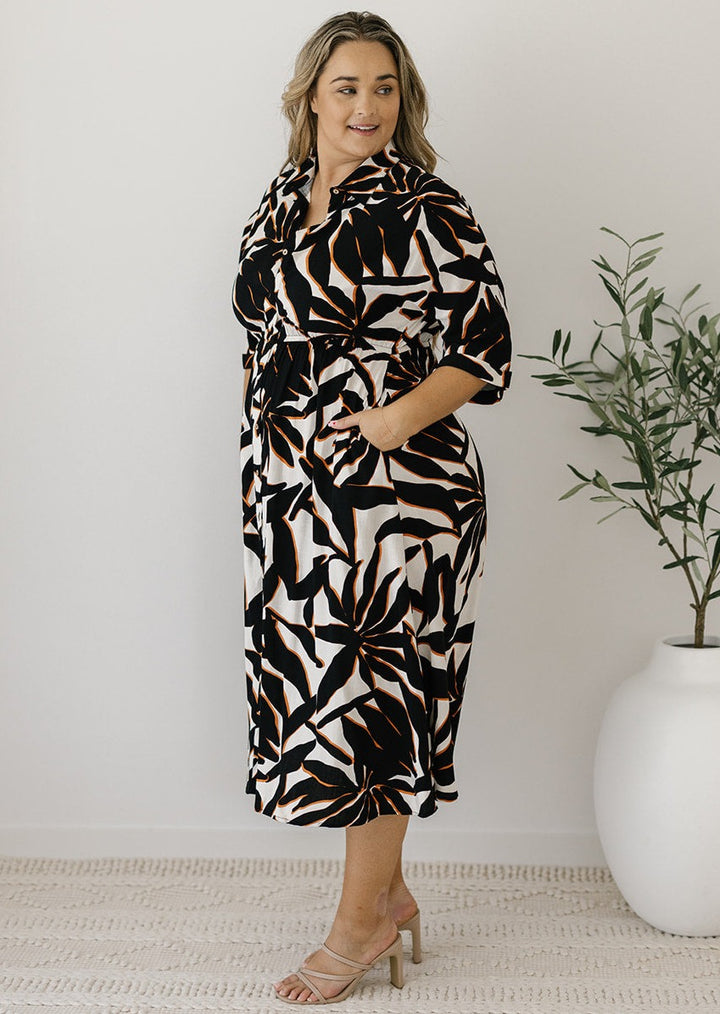 plus-size cream and black abstract print midi dress