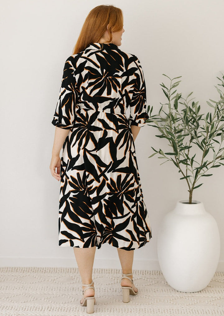 cream and black midi dress with elastic waist and collar