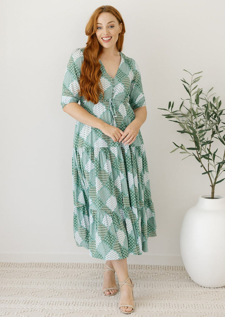 green pacthwotrk print maxi dress with drawstring waist and pockets