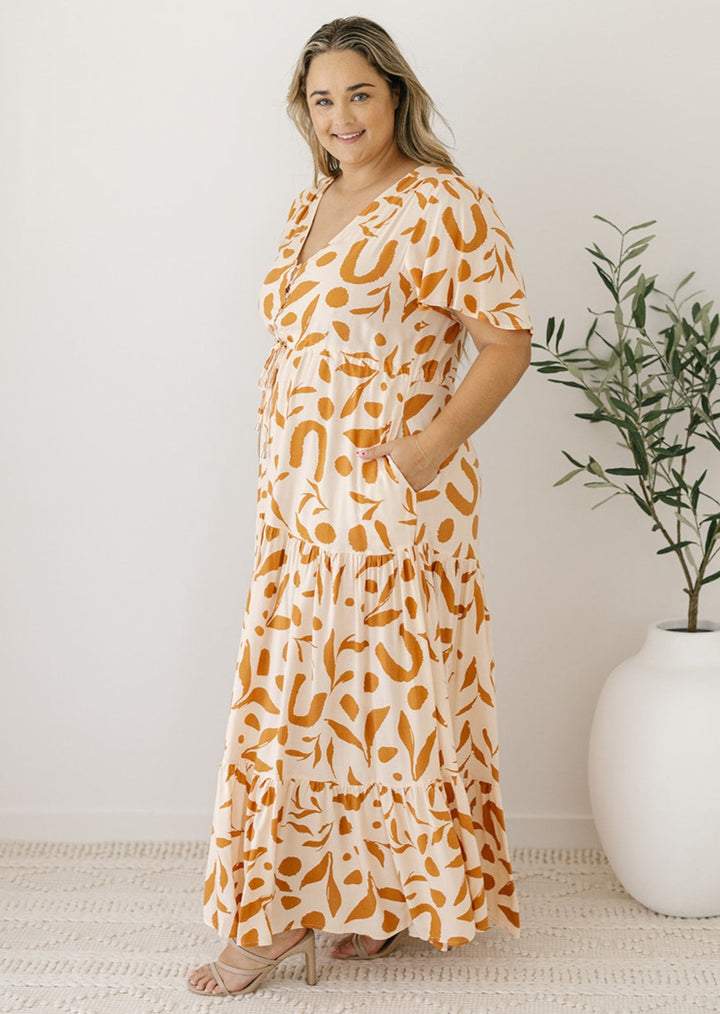 cream and tan abstract print maxi dress with pockets