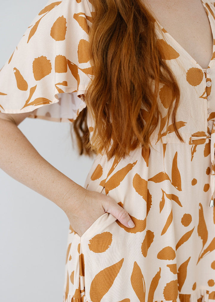 women's cream and tan maxi dress with pockets and drawstring waist