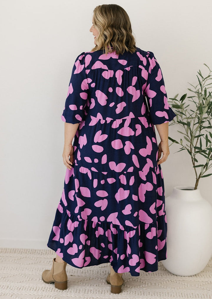 button-down collared midi dress in navy and pink abstract print with pockets
