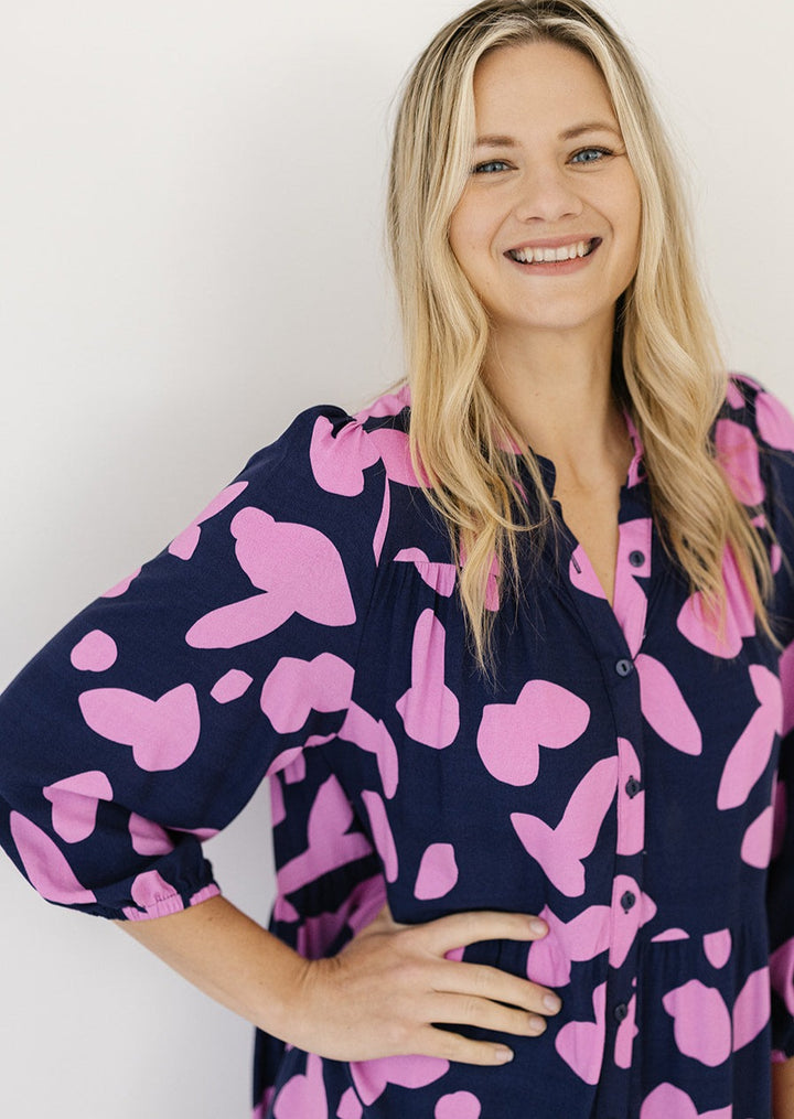 navy and pink abstract midi dress with 3/4 length sleeves and pockets