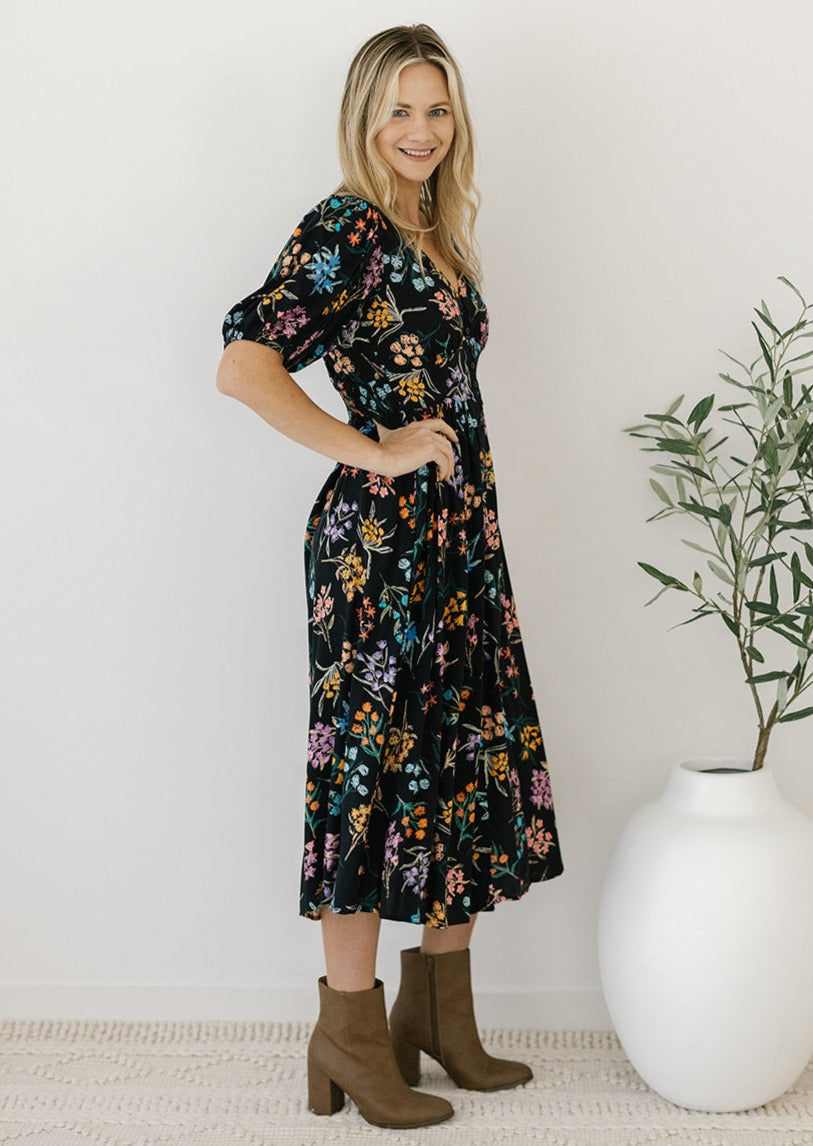 women's black floral button-down midi dress with pockets