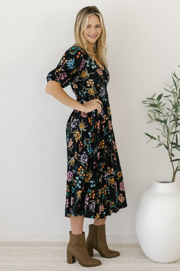 women's black floral button-down midi dress with pockets
