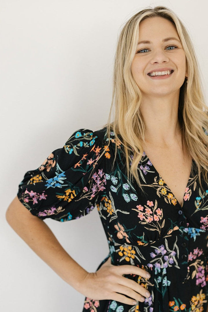 women's black and floral midi dress with sleeves