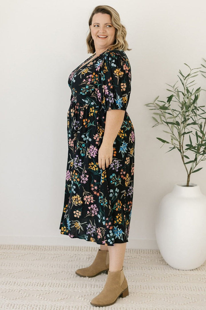 women's plus-size black floral midi dress with sleeves