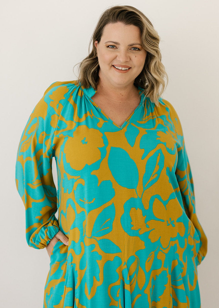 plus-size retro floral smock dress with long sleeves and pockets