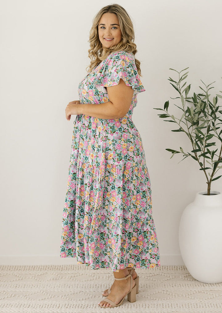 plus-size light floral midi dress with buttons and pockets