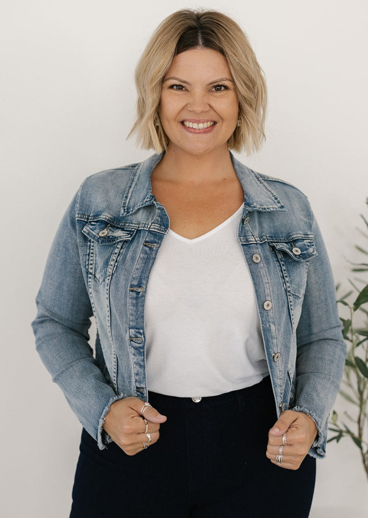 Acid-wash denim jacket with frayed hem