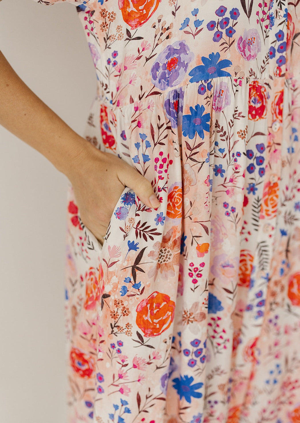 floral knee-length dress with functional buttons and pockets