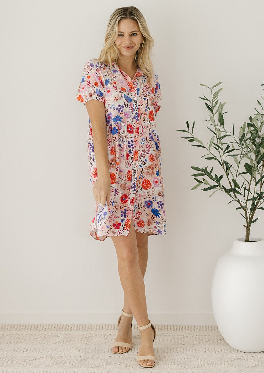 pink knee-length floral button-down dress
