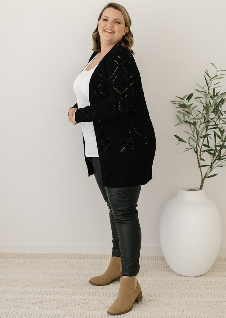 women's black cable-knit cardigan with pockets