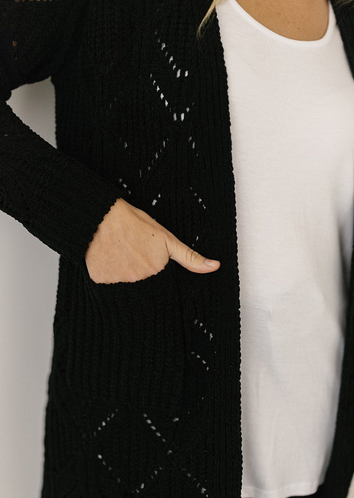 women's black cable-knit cardigan with pockets