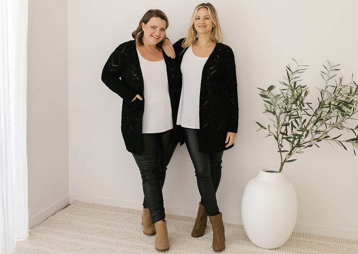 women's black cable-knit cardigan with pockets