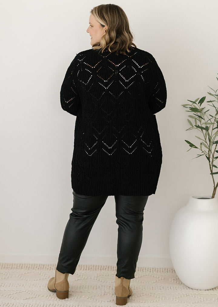 women's black cable-knit cardigan with pockets