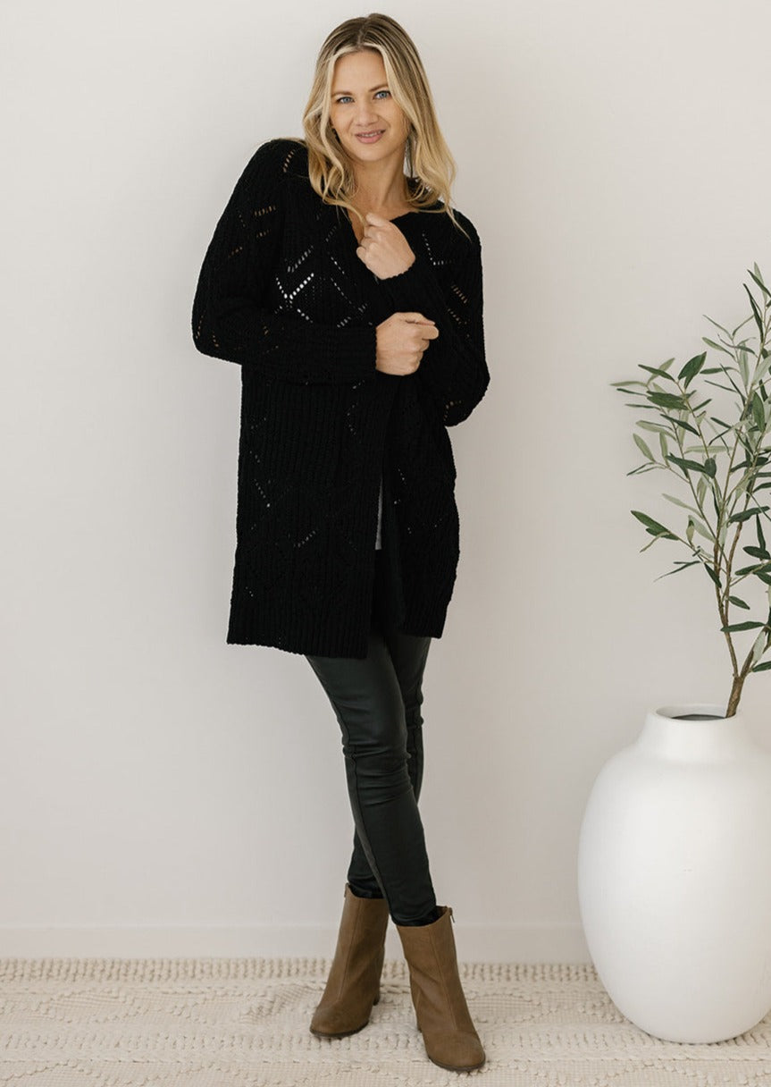 women's black cable-knit cardigan with pockets