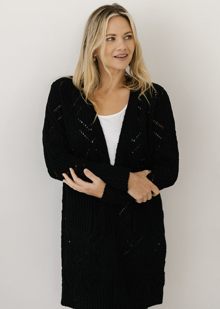 women's black cable-knit cardigan with pockets
