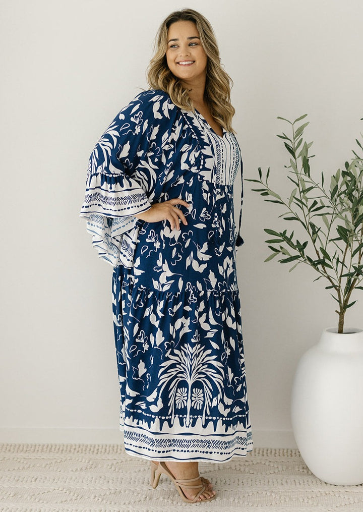 white and navy tunic-style maxi dress with pockets