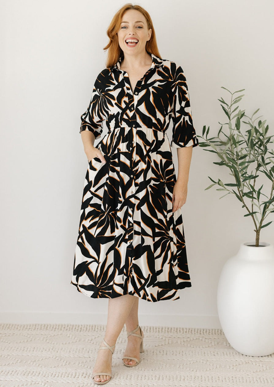 cream and black leaf print midi dress