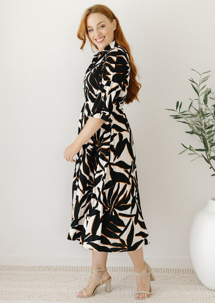 plus-size cream and black abstract midi dress with pockets