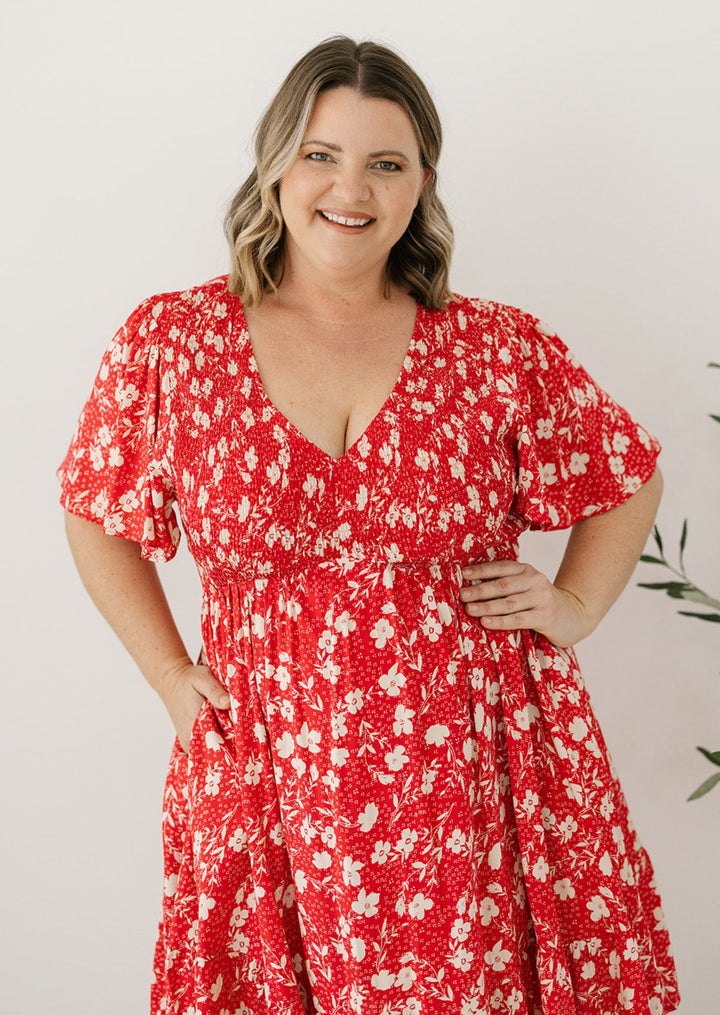 red floral shirred knee-length dress with pockets
