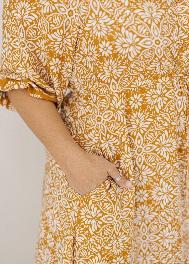 women's mustard and white floral print midi dress with drawstring waist