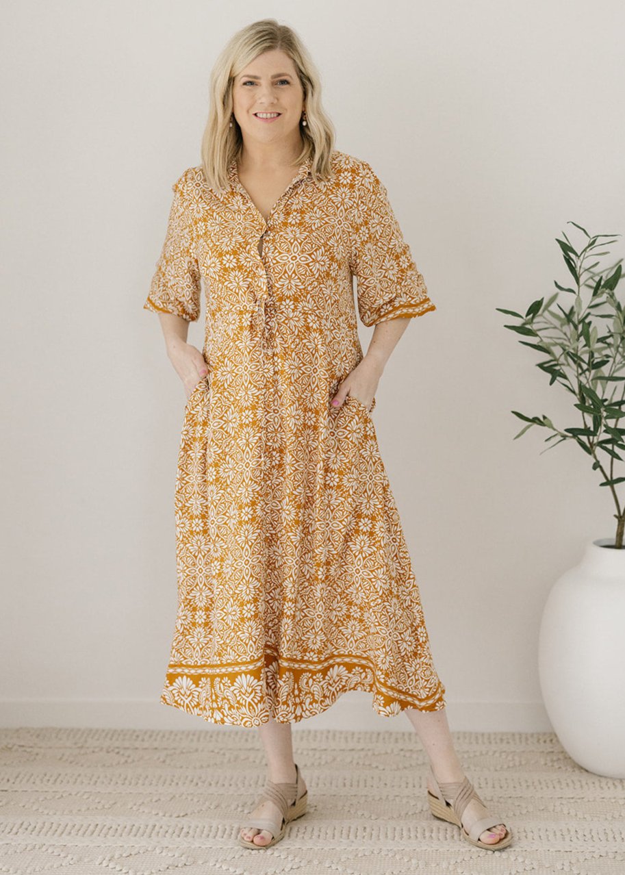 women's drawstring-waisted mustard and white floral print midi dress