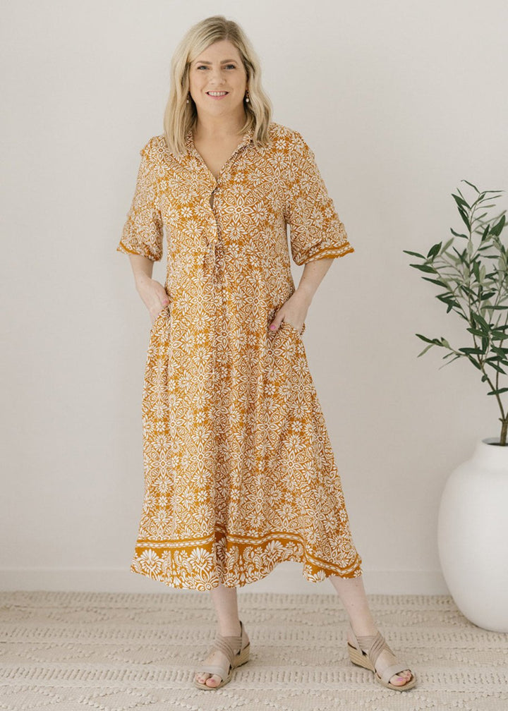 women's drawstring-waisted mustard and white floral print midi dress