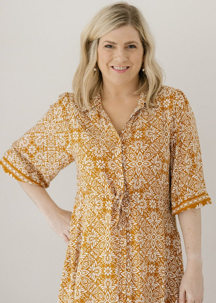 ladies bump-friendly mustard and white floral print midi dress