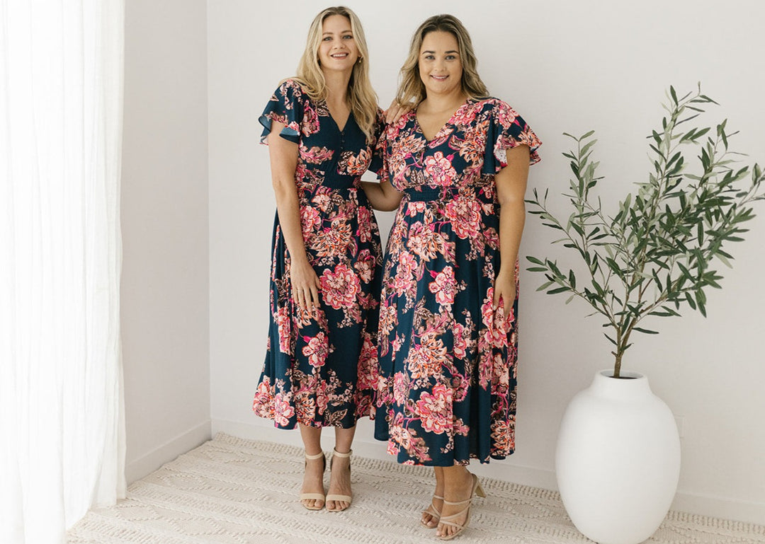 women's navy and pink floral midi dress with pockets