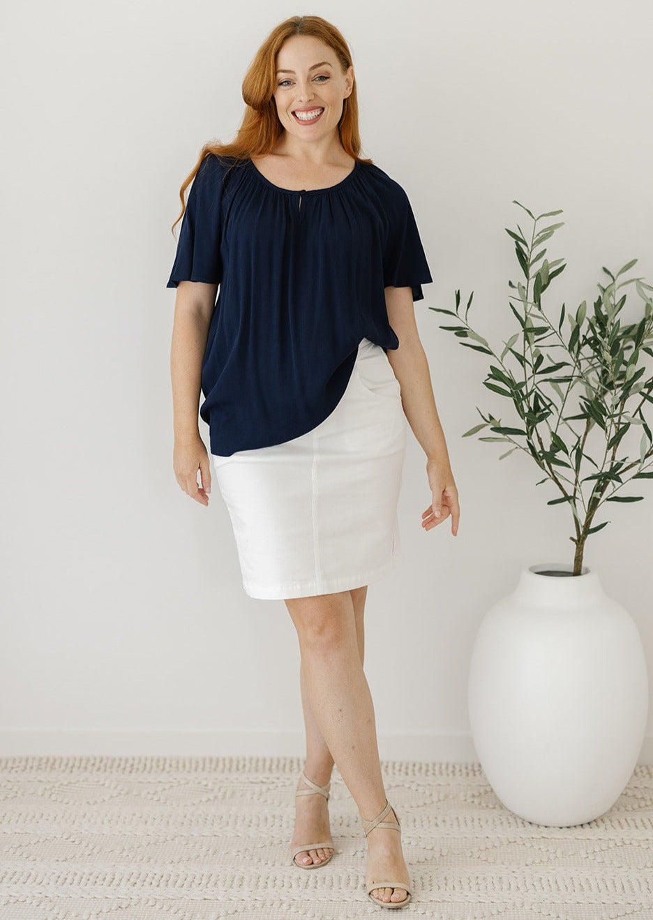 flowy navy blouse with flutter sleeves