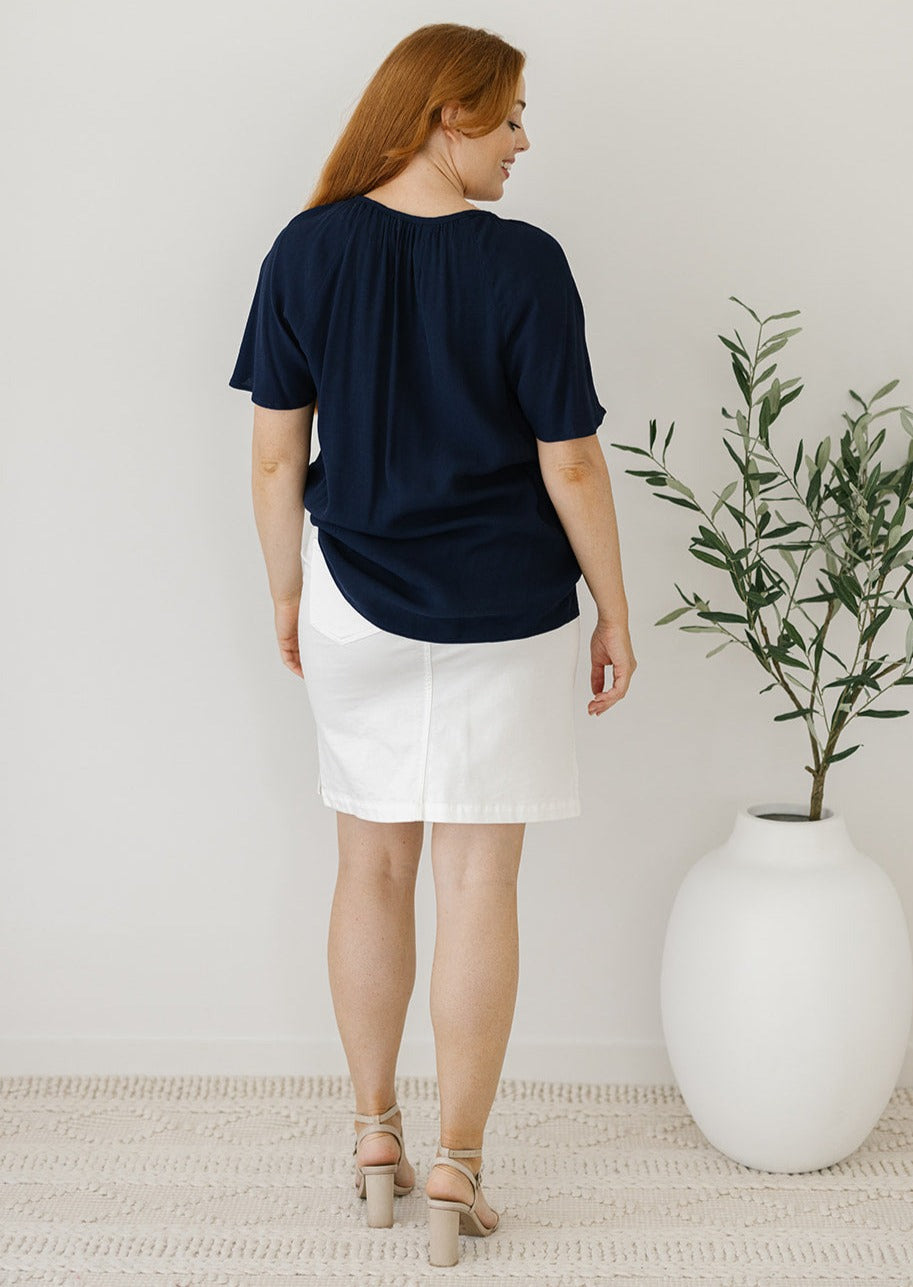 women's flowy navy top with flutter sleeves