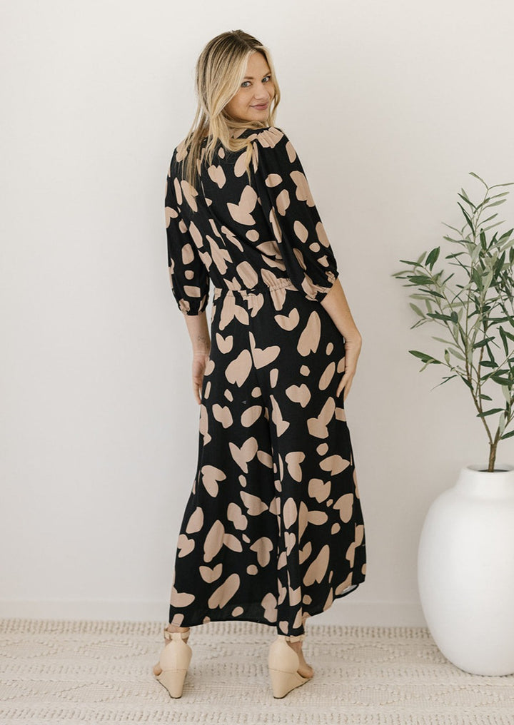 plus-size black and tan jumpsuit with petal print