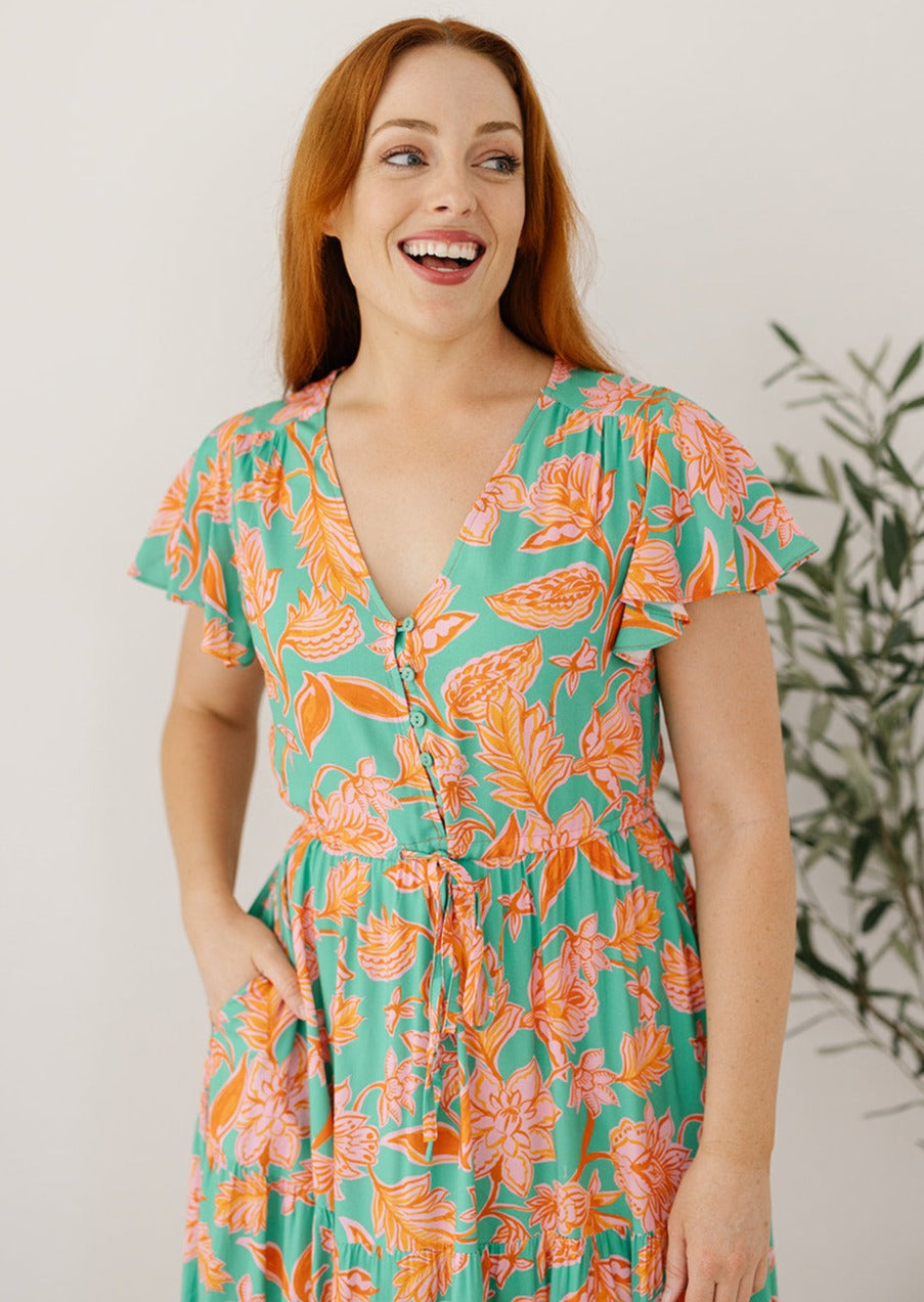 green and orange floral midi dress with pockets