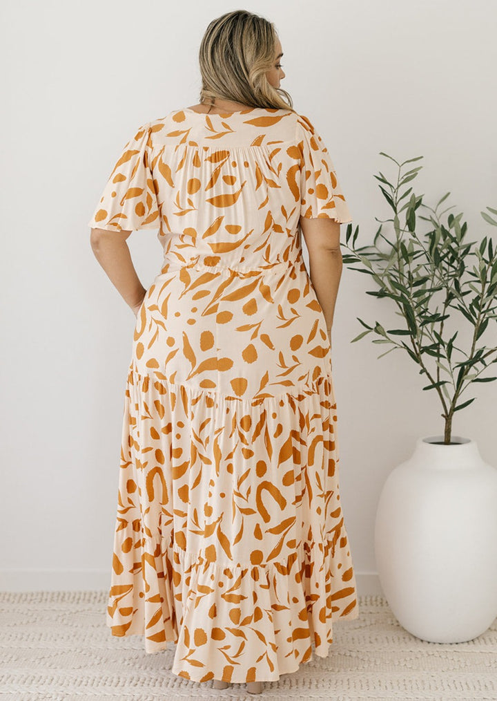 cream and tan abstract print maxi dress with pockets