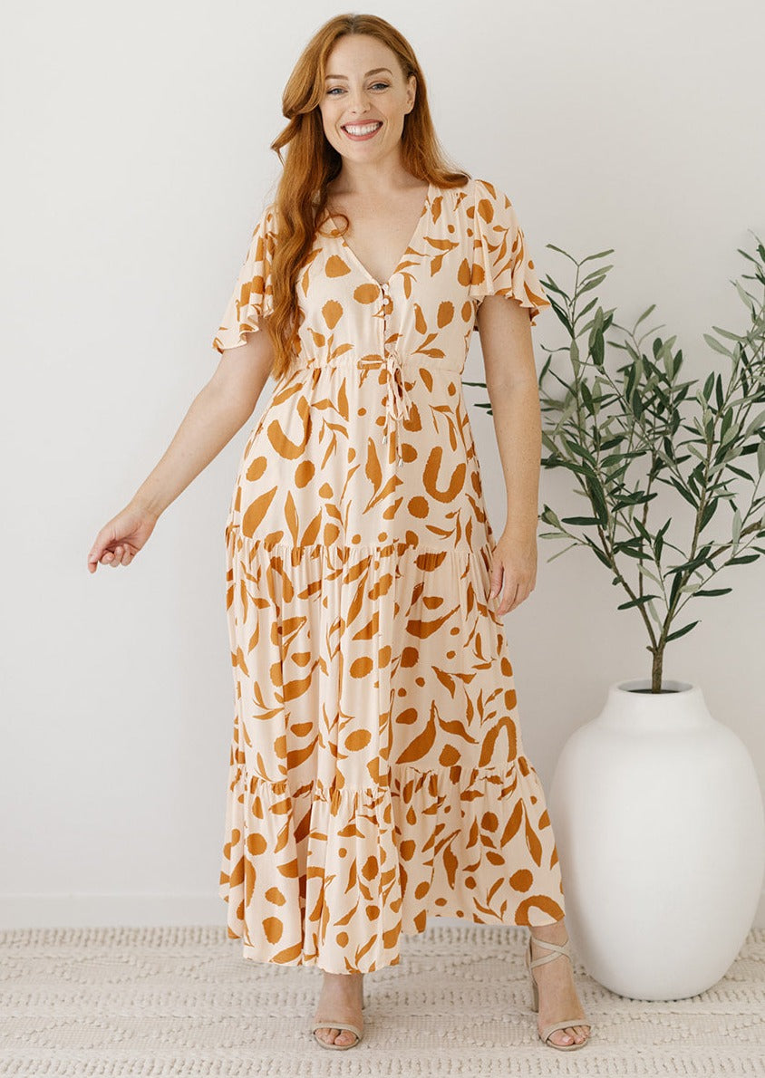 cream and tan leaf print maxi dress with drawstring waist