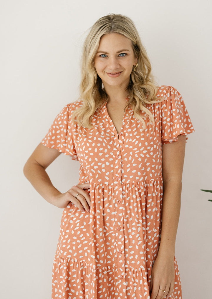 short-sleeved peach summer midi dress with pockets