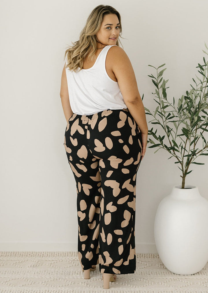 women's black and tan abstract pants with pockets