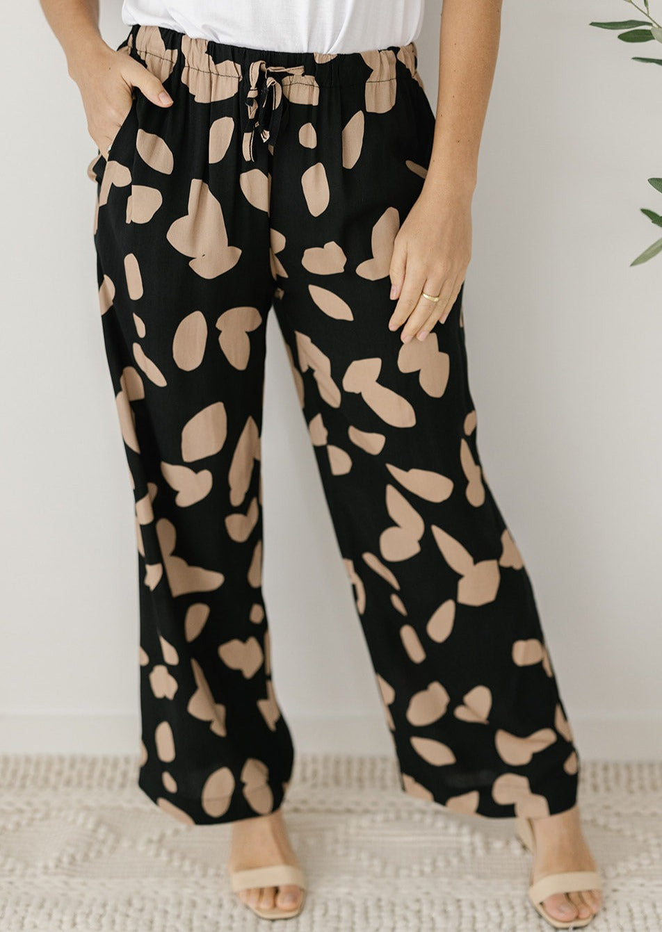 elastic-waisted neutral abstract pants with pockets