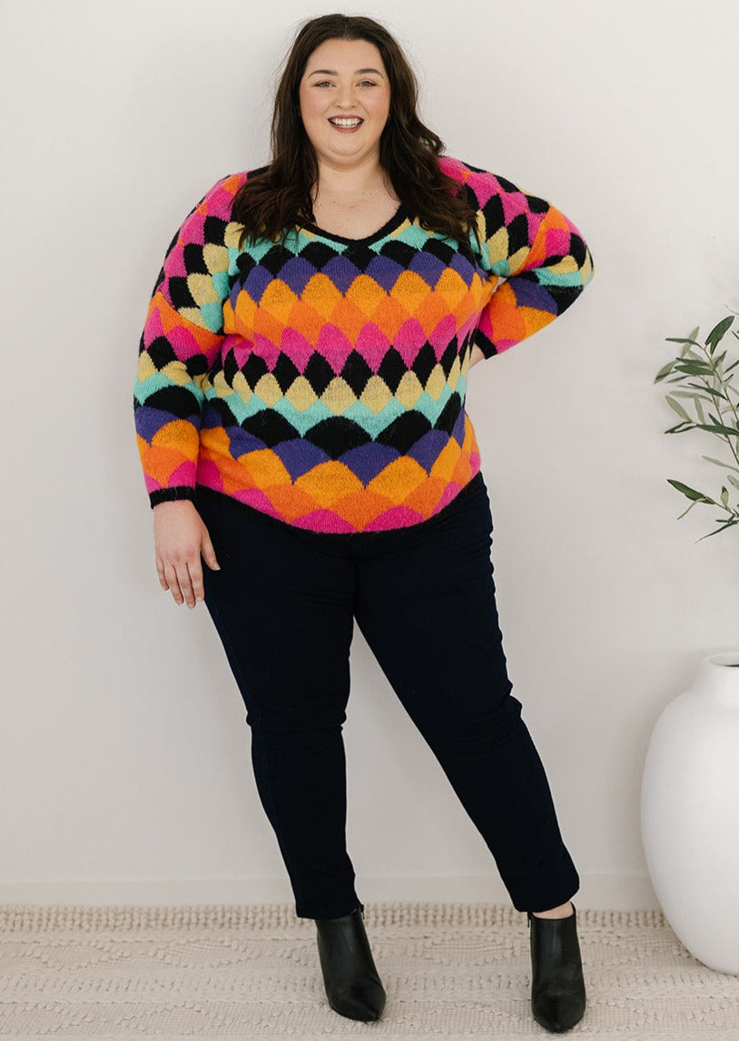 bright multicoloured abstract print knit jumper