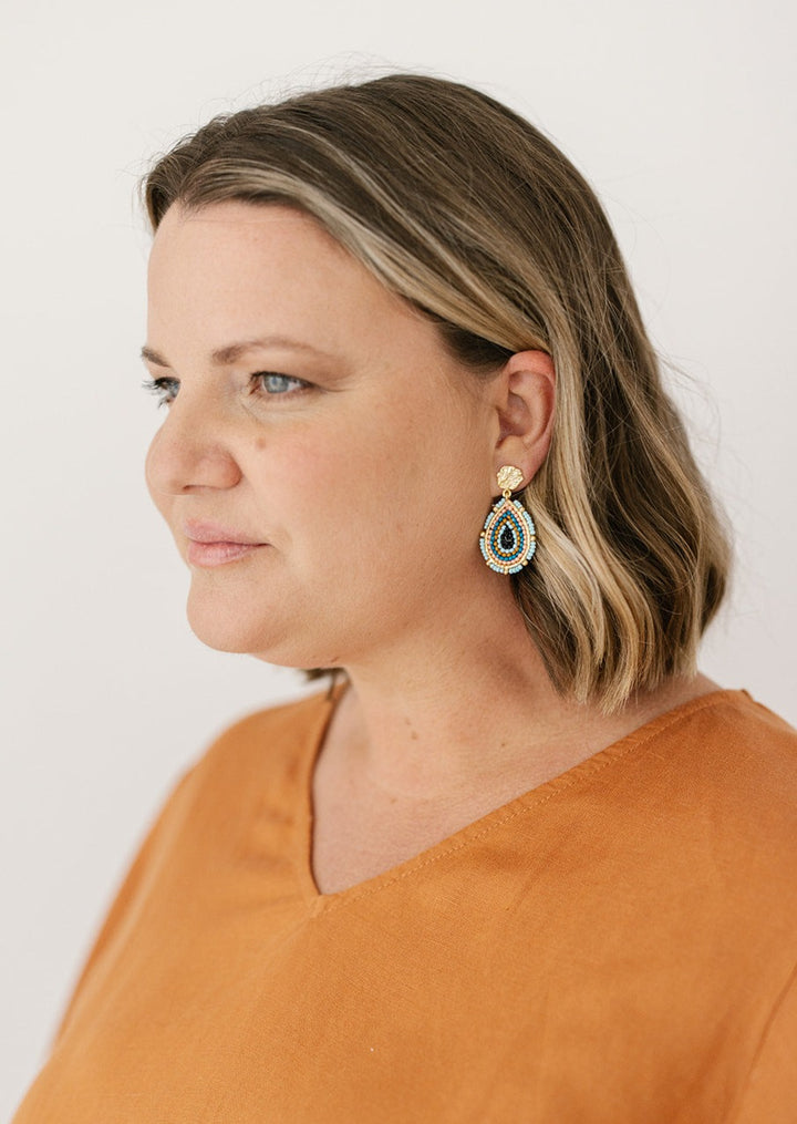 gold and blue teardrop earrings